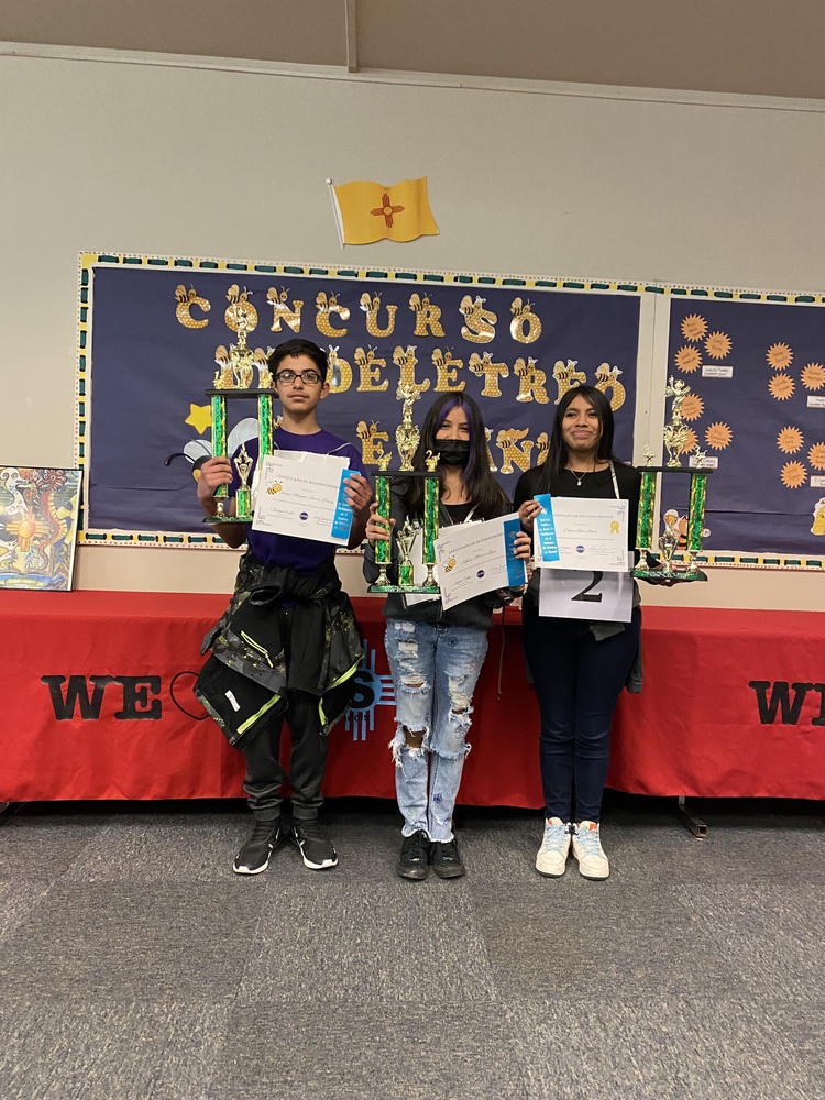 Spanish Spelling Bee Winners posing with the certificates and awards