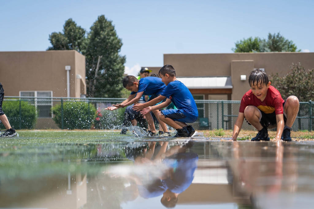 Students playing in puddles