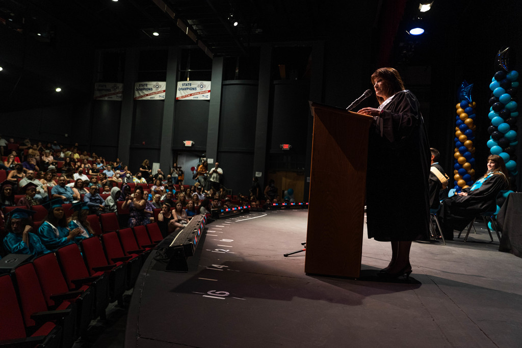 Santa Fe High School Principal Renee Salazar-Garcia speaks to auditorium