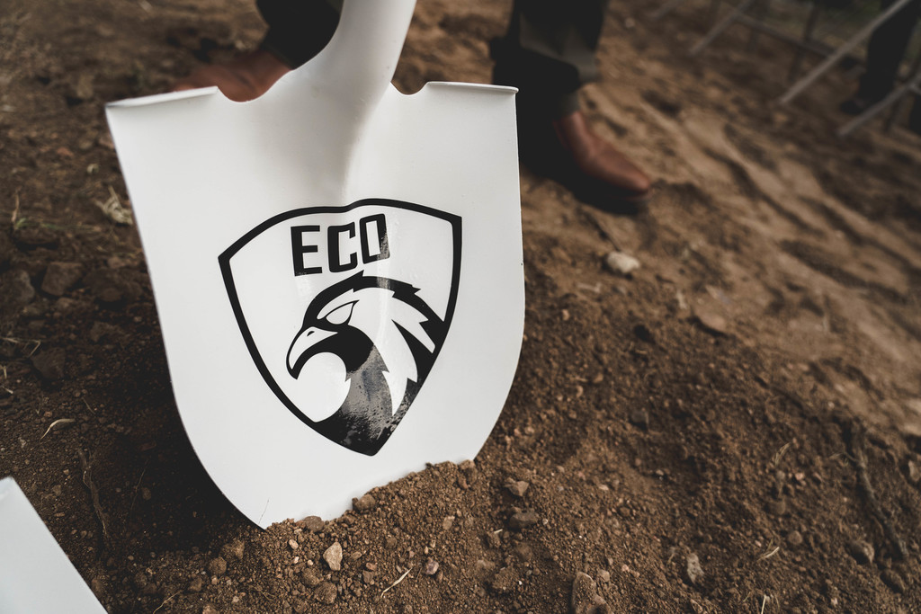 Shovel with ECO logo in the ground