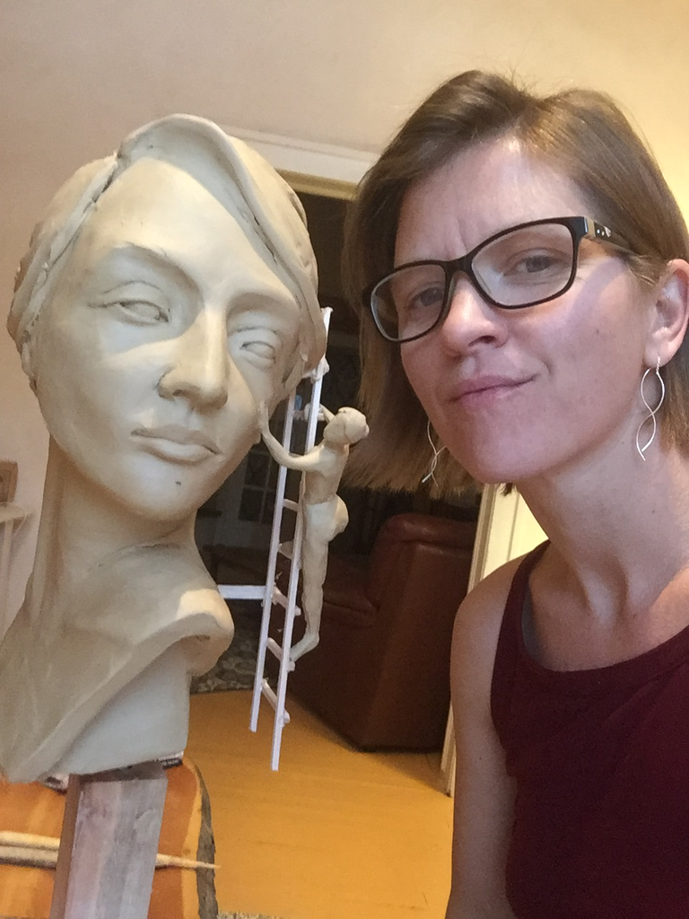 Teacher Alicia Hess with one of her sculptures