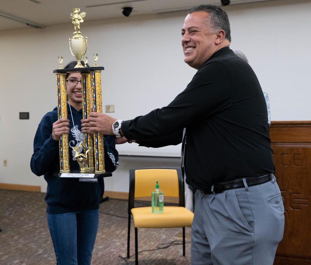 Carl Marano presents First Place trophy to Amaya Carreon