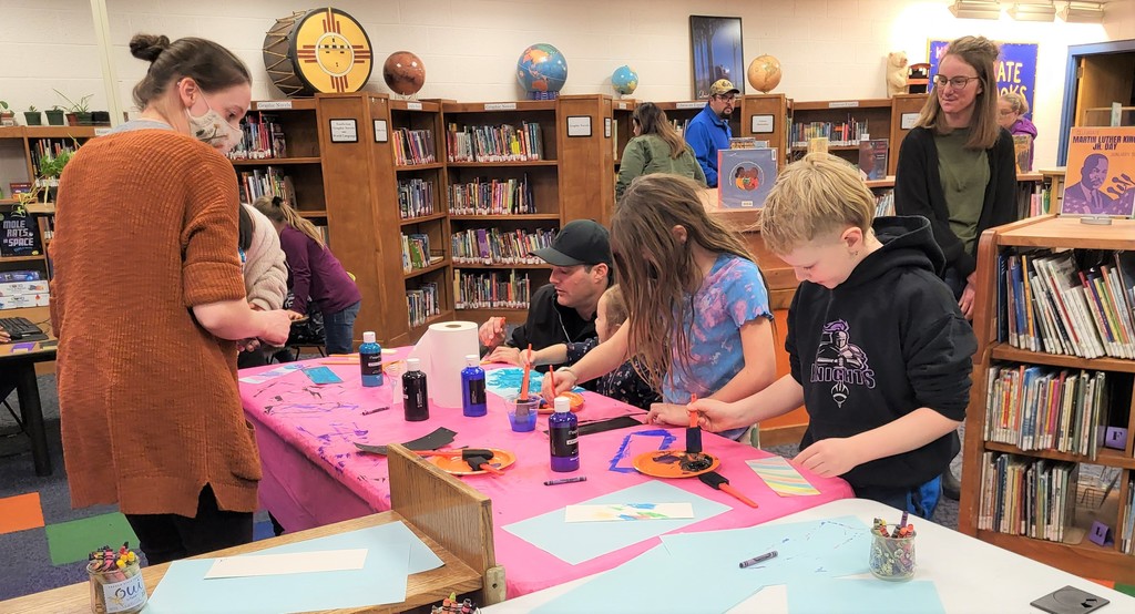 Students making crafts at the library