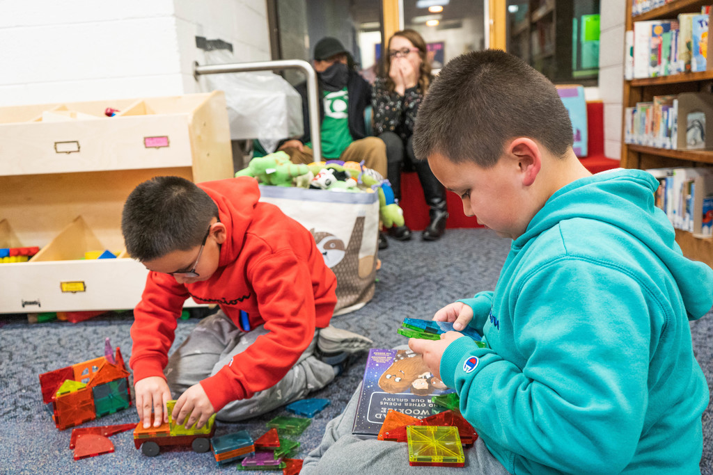 Students building with toys at the library