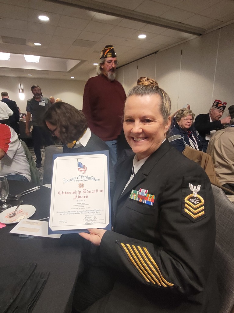 Chief Patricia Shipp holding award