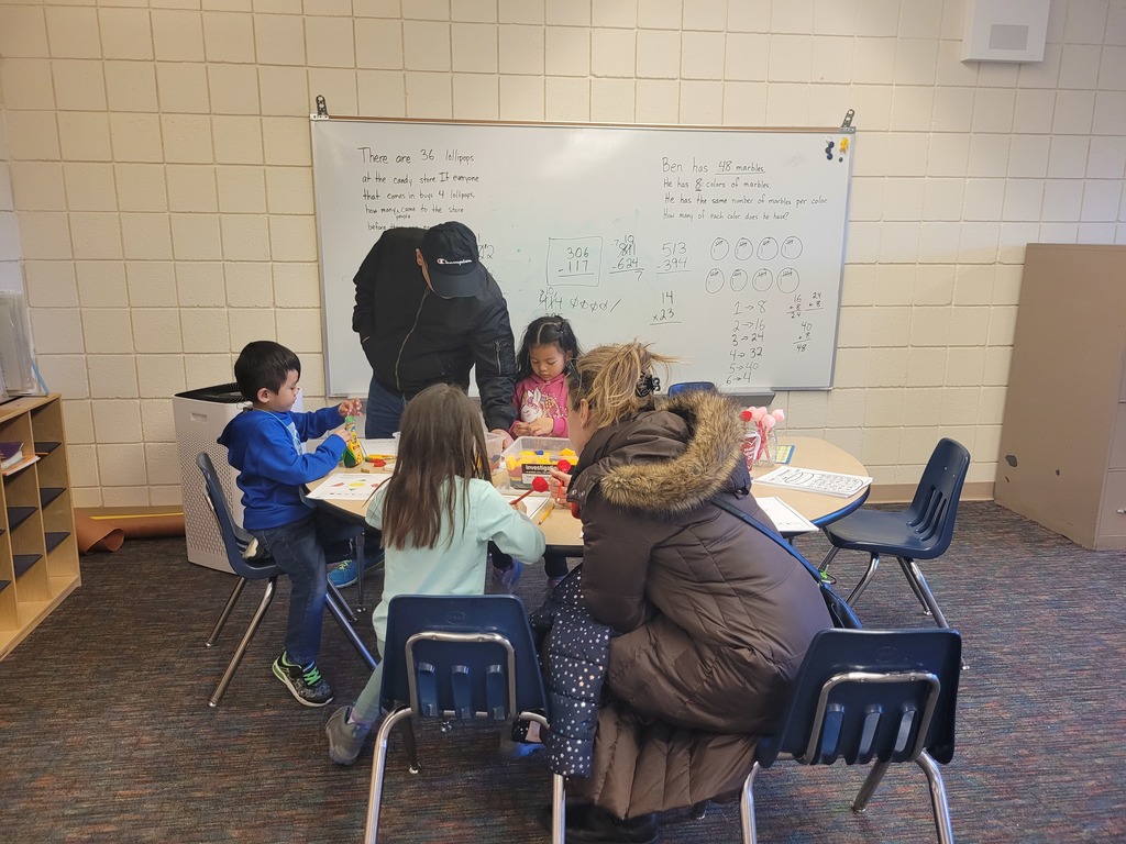 Students learning math with their parents