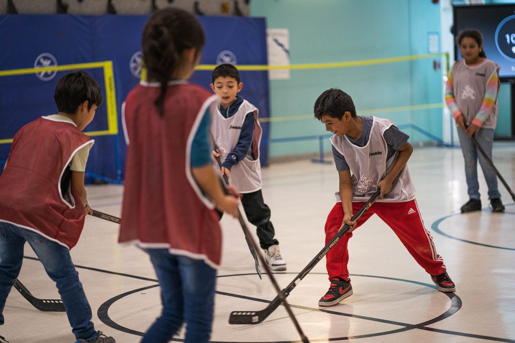 3rd grade student battling for a ball