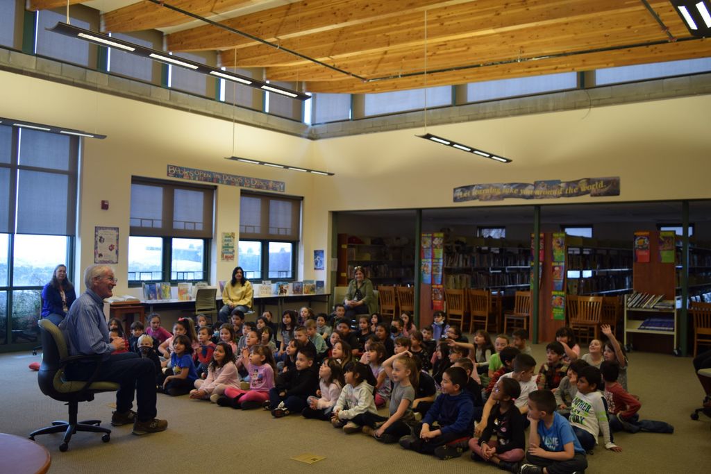 Joe Hayes speaking to Pinon Elementary 1sty graders in the library