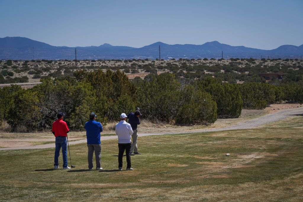Group hitting off the tee box