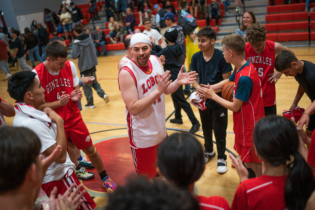 Principal Chris Lopez speaking to the group after a game