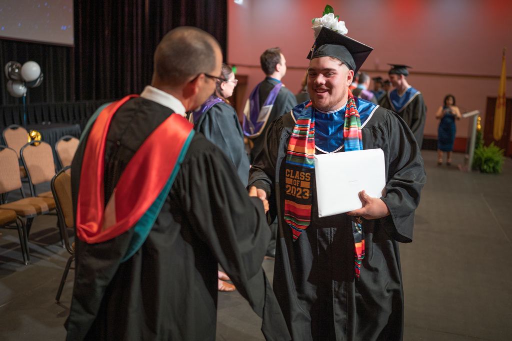 Superintendent Chavez congratulates student