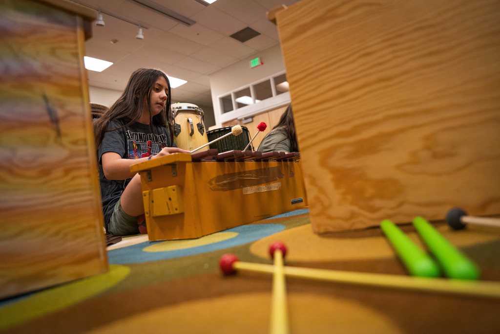 female student playing the xylophone